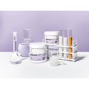 Radeq Lab Classic Line 3 Sugar paste ingredients and containers arranged on a white surface against a light lavender background, including labeled white tubs, a beaker, a flask, a small glass mug with ice, and test tubes in a white rack.