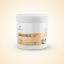 A white plastic jar of Radeq Lab Classic Line Sugar Paste, featuring a beige label with black text, set against a soft beige gradient background.